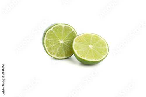 Juicy lime halves isolated on white background