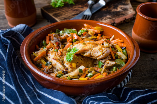 Fried chicken fillet with vegetables.