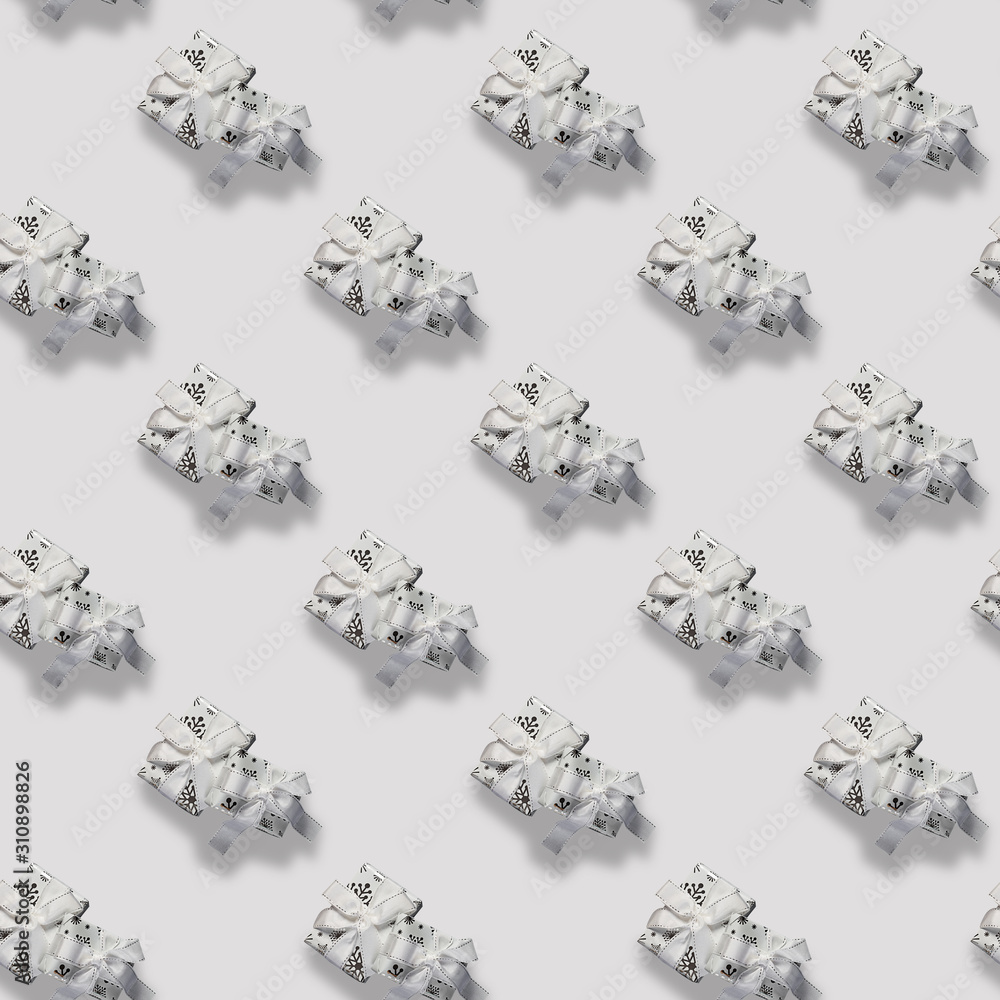 Seamless Christmas pattern with white box on neutral pastel grey background. New Year gift. Seamless Christmas pattern with white box on neutral pastel grey background. New Year gift.