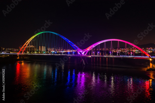 Crescent Bridge - landmark of New Taipei, Taiwan with beautiful illumination at night, photography in New Taipei, Taiwan. © yaophotograph