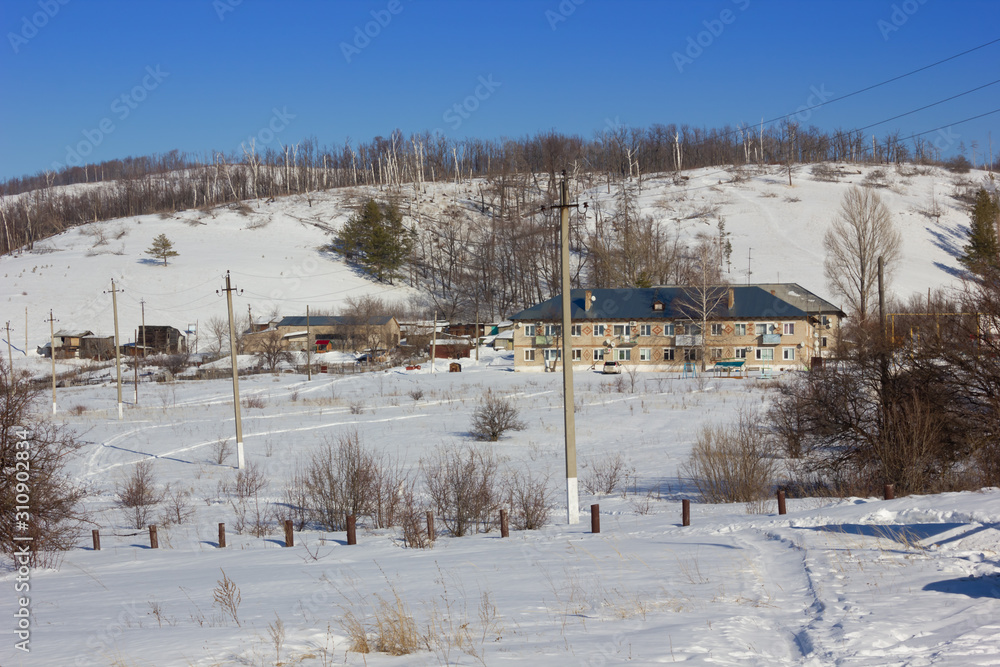 Winter snowy landscape with hills and trees