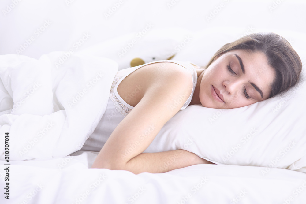 beautiful young woman basking in bed in the morning. Beautiful beautiful young woman basking in bed in the morning. Beautiful