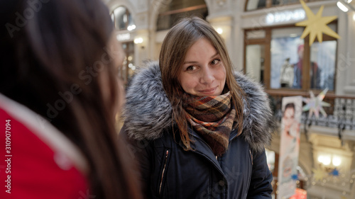 Wallpaper Mural The meeting of the girlfriends. Two women are discussing something in a shopping center. Torontodigital.ca