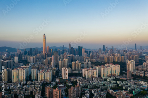 an aerial view of shenzhen city skyline at dusk moment in winter © Jingye