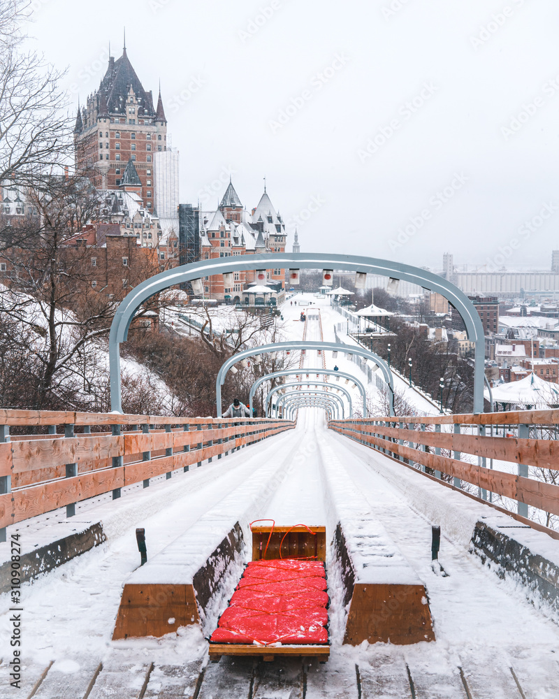 Fototapeta premium Toboggan slide in Old town of Quebec Canada. Can see the Chateau frontenac in background 