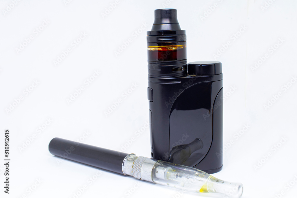 Two varieties of electronic cigarettes, close-up, isolated on a white background. Two varieties of electronic cigarettes, close-up, isolated on a white background.