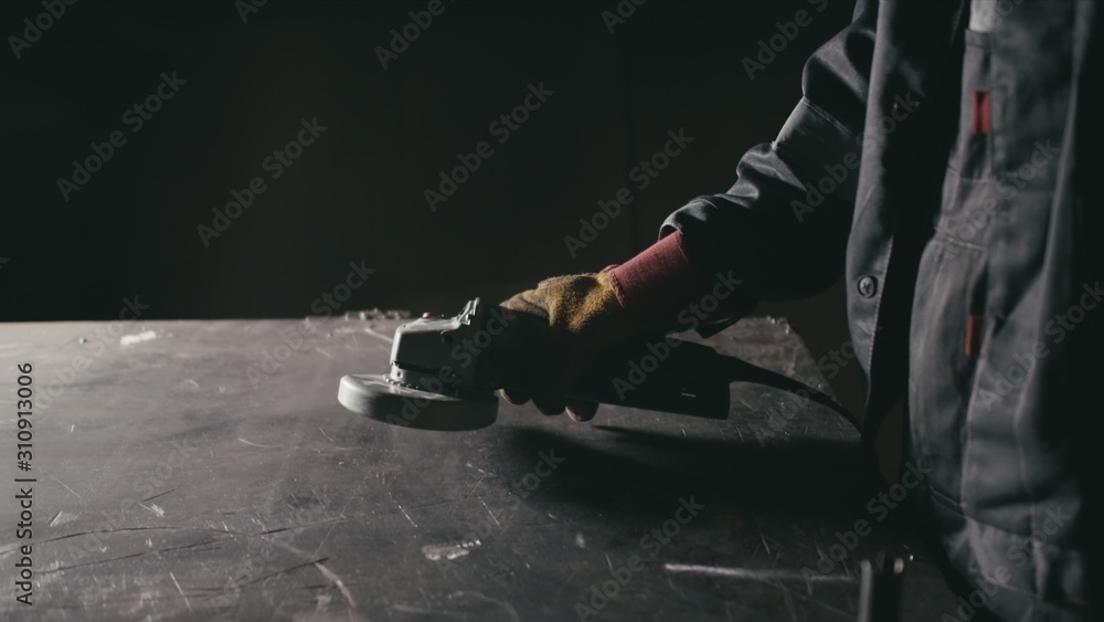 Forge workshop. Smithy manual production. Industrial worker using angle ...