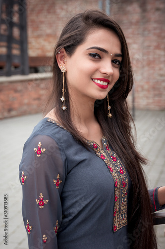 Portrait of indian girl in traditional dress. Traditional accessories of Indian girls.  photo