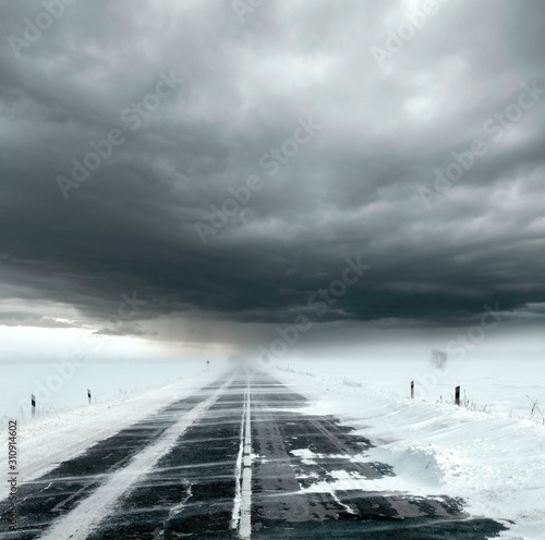 Stormy sky and snow road