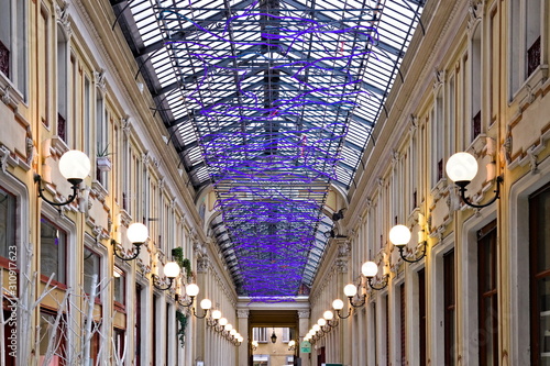 Turin, Italy - December 14, 2019: The Umberto I Gallery is one of the current three historic shopping galleries in Turin. It connects Piazza della Repubblica to Via della Basilica photo