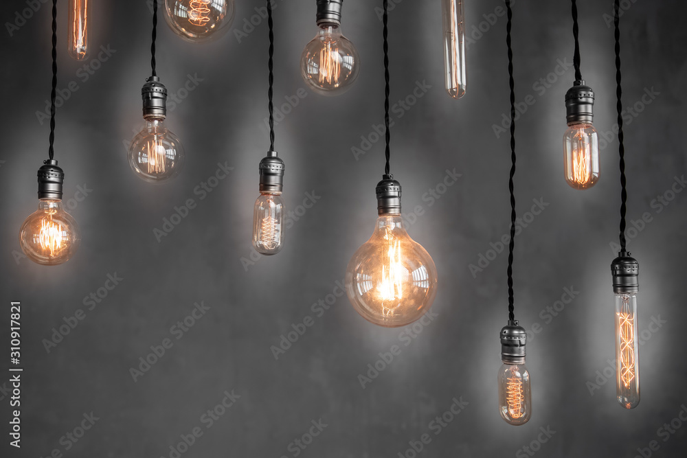 Edison lamp is included in loft room, against background of concrete wall Edison lamp is included in loft room, against background of concrete wall