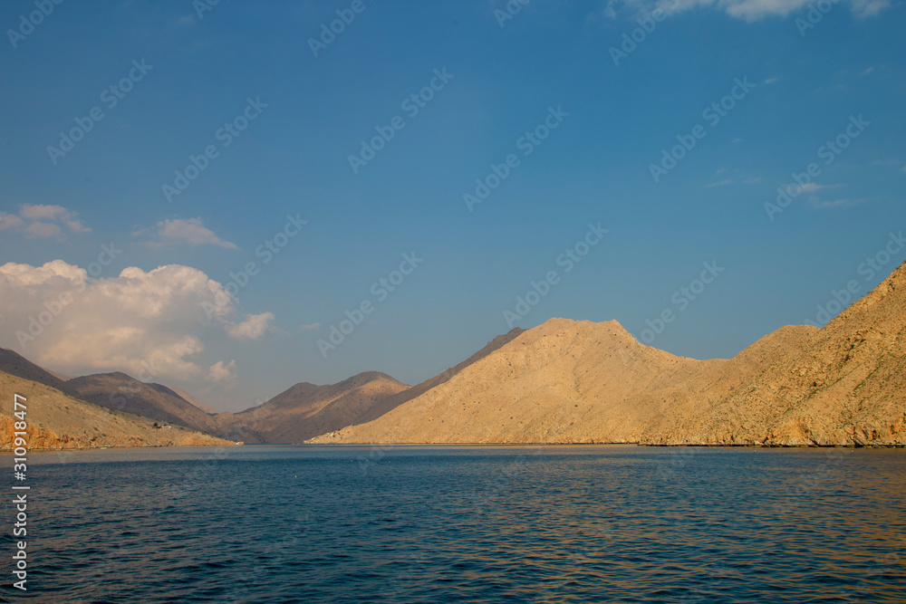 mountains and rocks by the indian ocean in oman