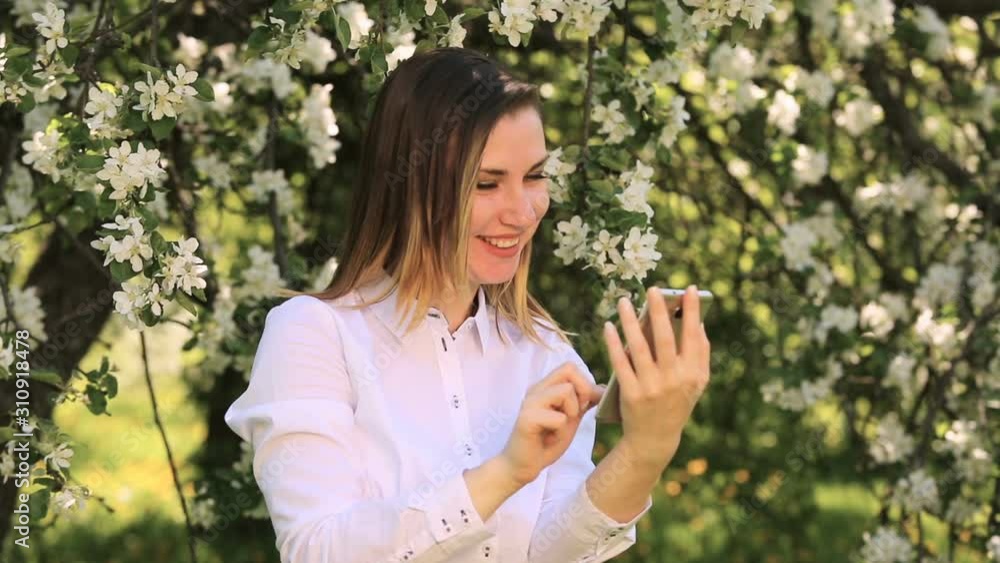Young cute girl looking at the phone Young cute girl looking at the phone