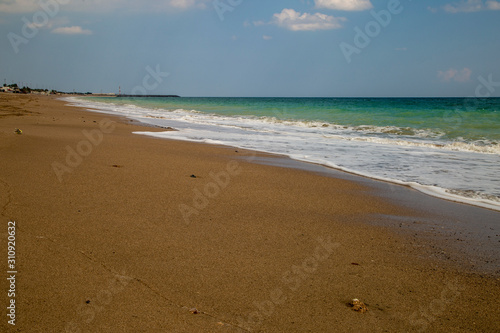 sandy ocean shore  sky and clouds