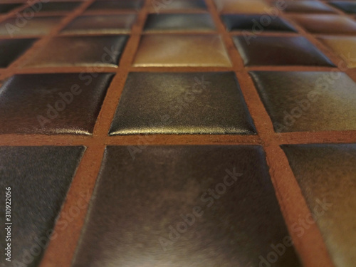 perspective texture of ceramic brown mosaic tiles