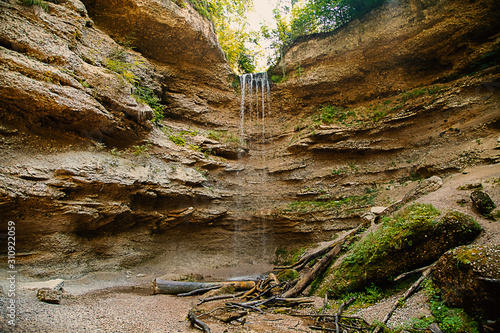 Wasserfall in einem kleinen Felstal mit Nagelfluhfelsen photo