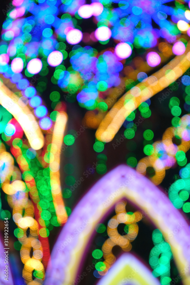 Abstract Christmas background, bokeh of colorful garlands.