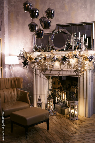 A beautiful living room with fireplace decorated for Christmas and Happy New Year