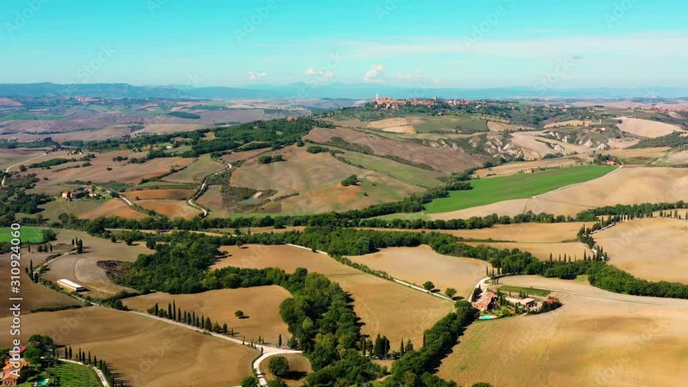 Italian field all over the horizon with agricultural fields and meadows Aerial view of the beautiful old village of Monticchiello Tuscany, Italy Italian field all over the horizon with agricultural fields and meadows Aerial view of the beautiful old village of Monticchiello Tuscany, Italy
