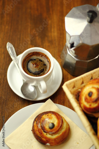 Fototapeta Naklejka Na Ścianę i Meble -  Coffee Cup and Bread Roll. Continental Breakfast.