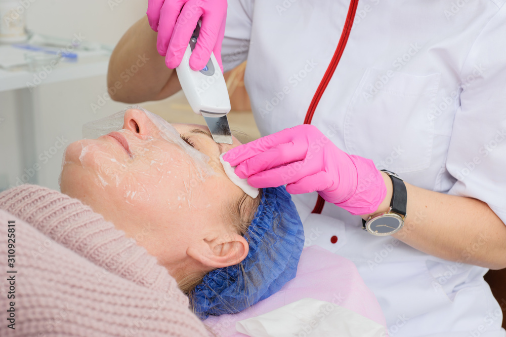 specialist performs the procedure of ultrasonic cleaning specialist performs the procedure of ultrasonic cleaning