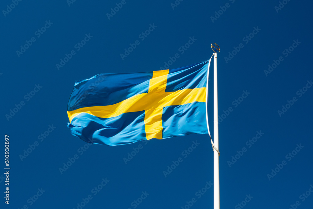 Swedish national flag on blue sky background