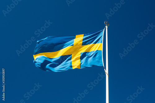 Swedish national flag on blue sky background