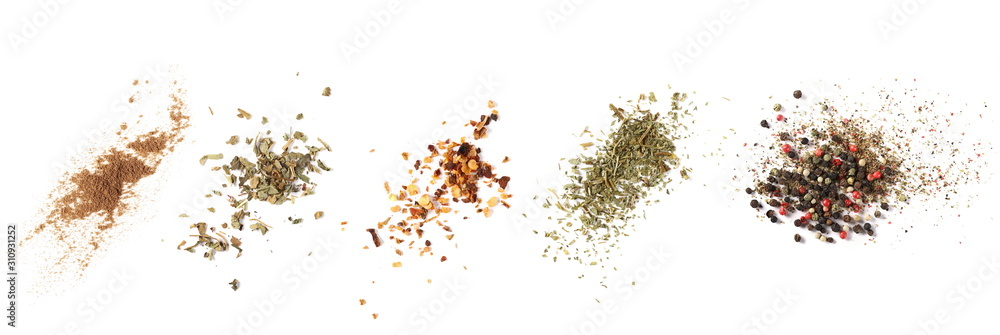 Fototapeta Set cinnamon powder, basil, ground dry chili pepper, parsley, colorful pepper grain and minced, background, top view texture