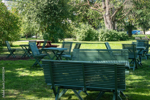 Obraz na płótnie Stadsparken with wooden benches in Uppsala, Sweden w salonie