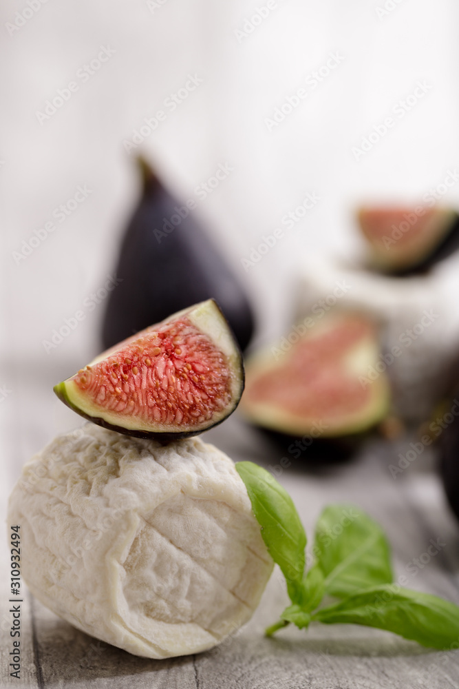 Sweet fresh figs and goat cheese  healthy and delicacy diet. Selective focus with copy space