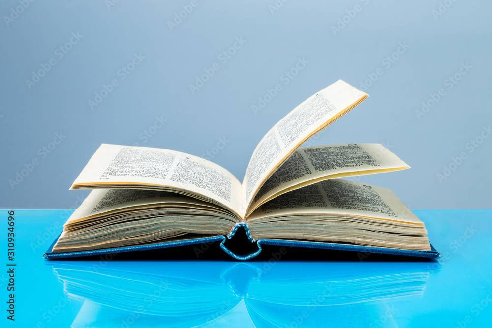 Obraz premium Open book on the table, free access to knowledge and information concept