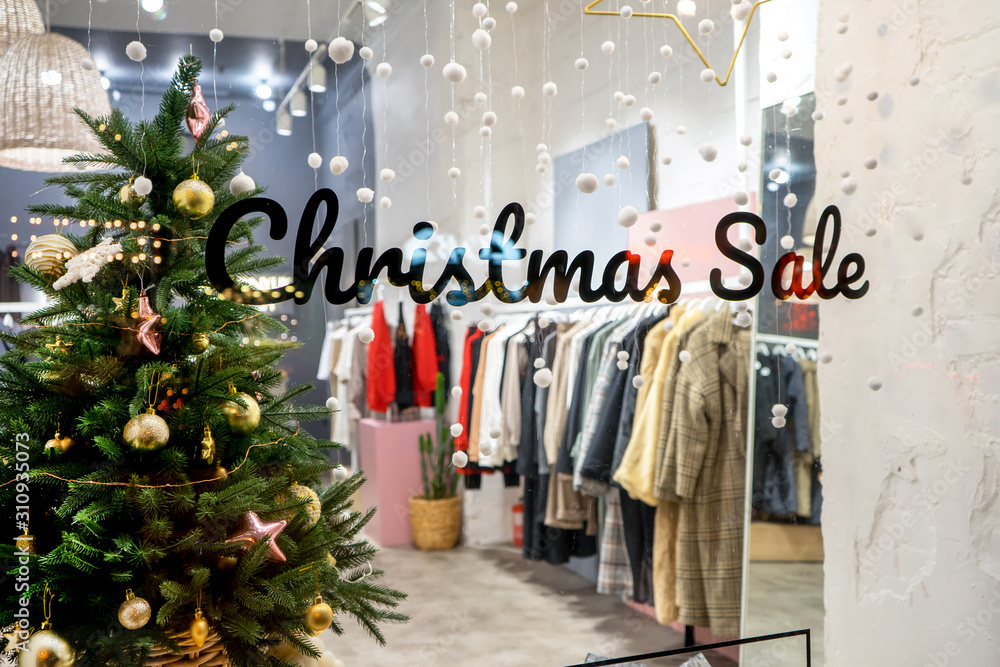Window of a clothing store with the inscription Christmas Sale: Odessa,  Ukraine; December 18, 2019: Stock Photo | Adobe Stock