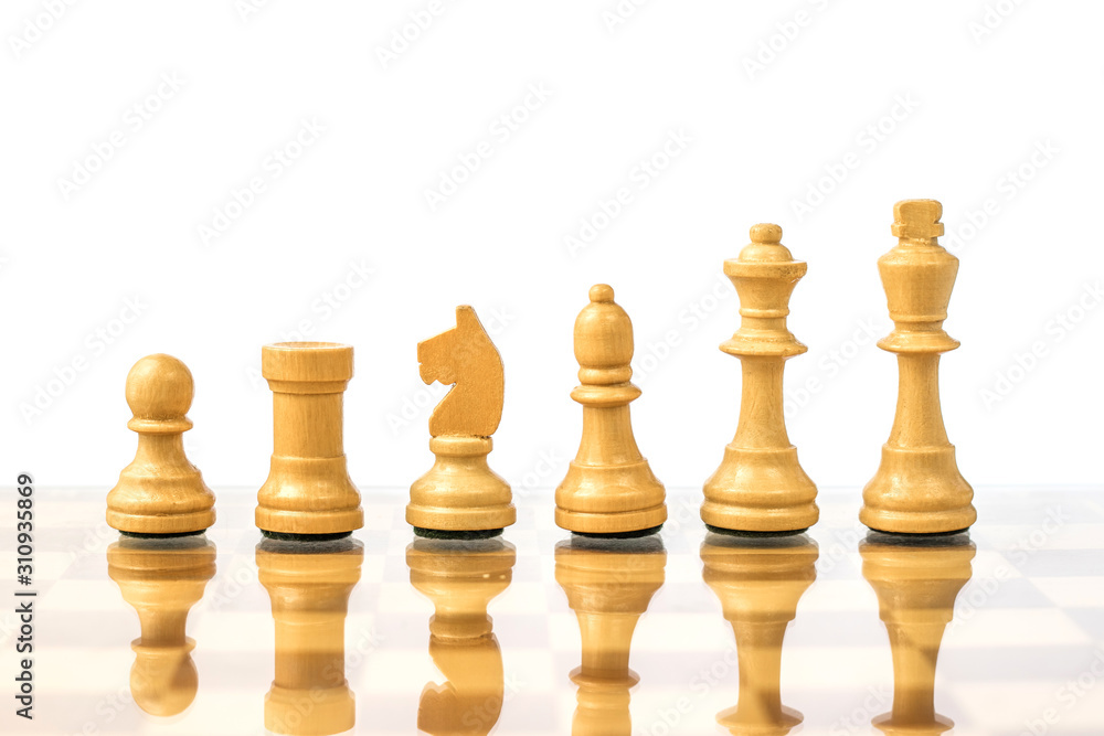 White chess pieces on a chessboard in ascending order. Career growth concept White chess pieces on a chessboard in ascending order. Career growth concept