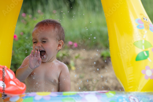 Water splashes by toddler photo