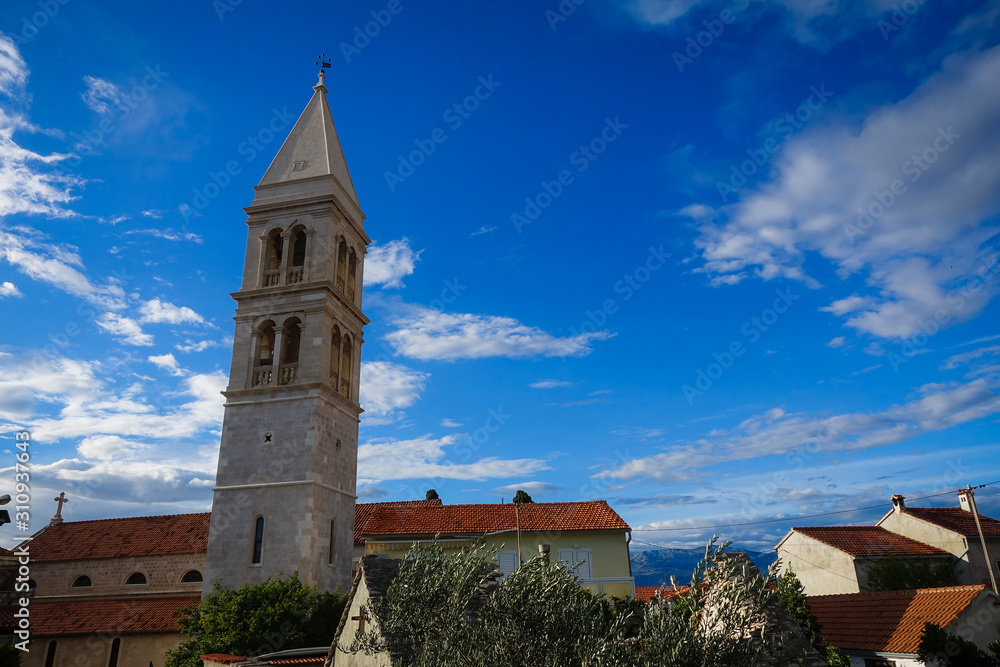 Obraz premium Supetar, Croatia / June 27th 2018: Church of Saint Peter, sveti Petar in old town Supetar, Brac Island. Croatia, Europe