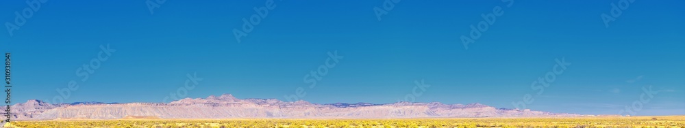 Fototapeta premium Moab Panorama views of desert mountain ranges along Highway 191 in Utah between Moab and Price in fall. Scenic nature near Canyonlands and Arches National Park. United States of America. USA.