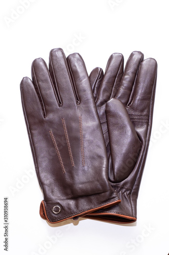 Leather, brown gloves on a white background. Isolated