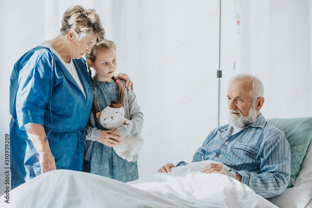 Girl supporting grandfather Girl supporting grandfather