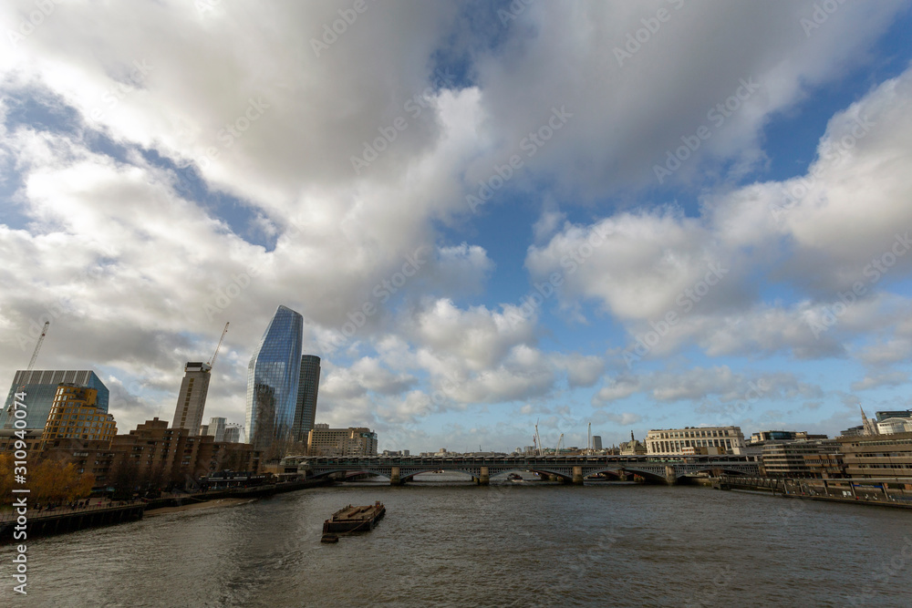 View of the city of London with the river Thames in the foreground
