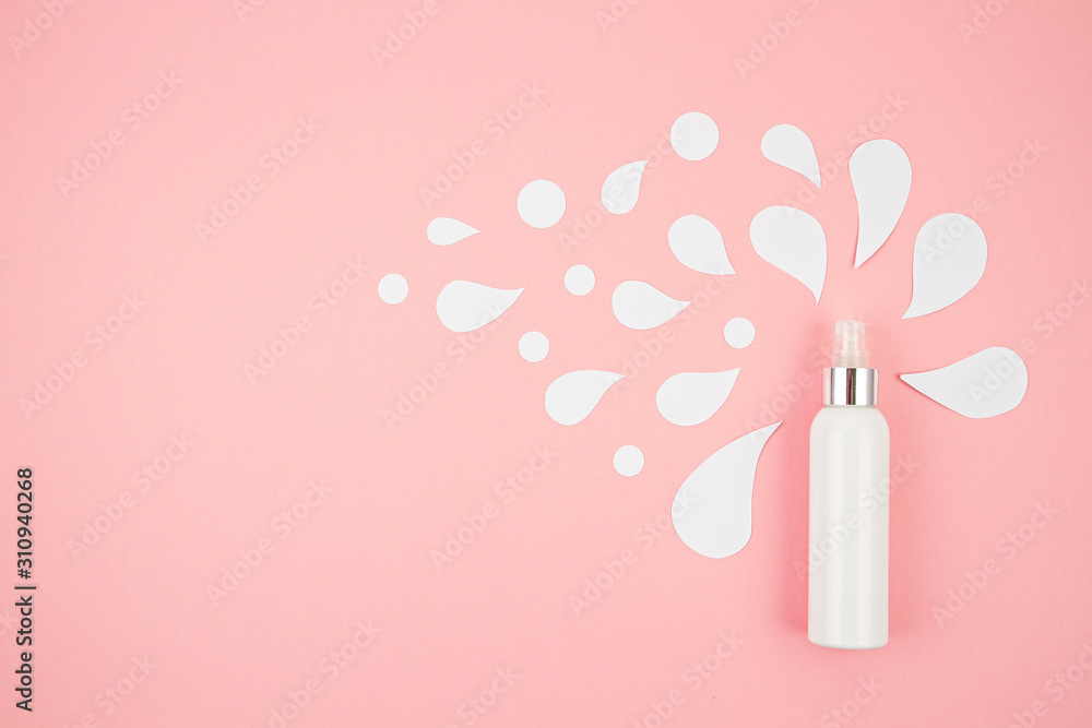 Cosmetic bottle on pastel modern paper background with paper cut splashes. Mock-up for product package branding