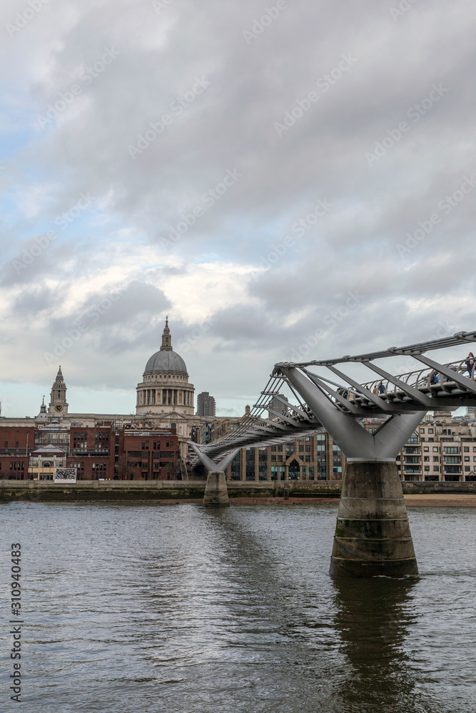 Naklejka premium View of the city of London with the river Thames and the Millennium Bridge in the foreground