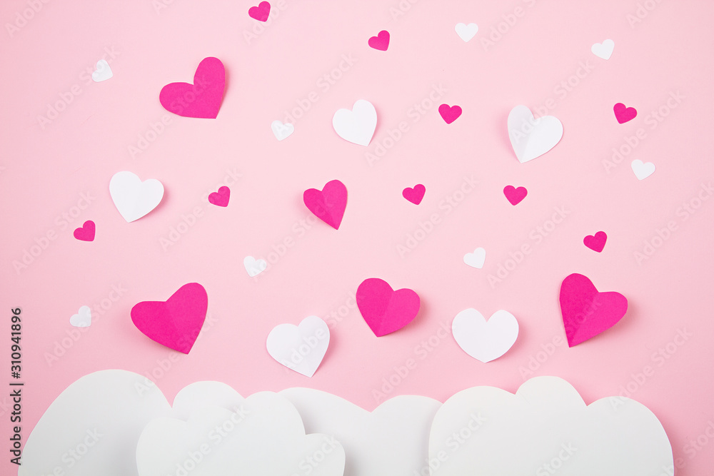 Paper hearts and clouds over pink background. Love, Sainte Valentine, mother's day, birthday greeting cards, invitation, celebration concept