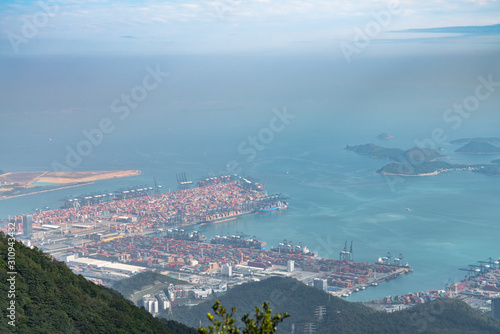 Panorama view of Shenzhen cityscape from top of Wutong Mountain on a sunny day