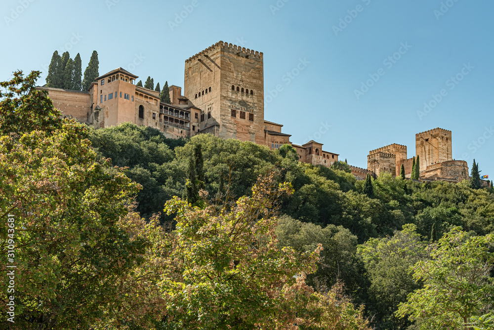 View of the famous palace of Alhambra in Granada, Spain. Low angle view of the majestic palace and fortress