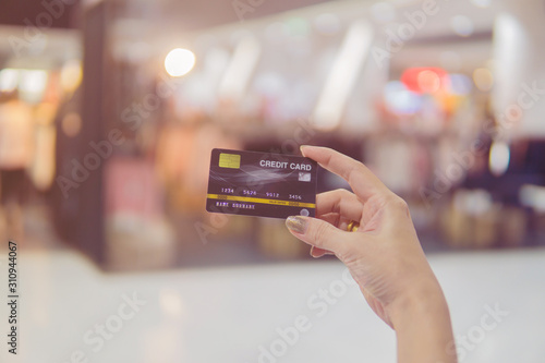 Close up of woman hand holding credit card for shopping.