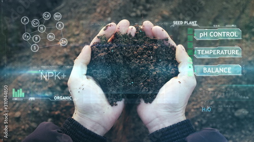 POV view of farmer owner control soil quality before seed plant. Future agriculture concept. Close-up hands with the ground. Smart farming, using modern technologies in agriculture photo