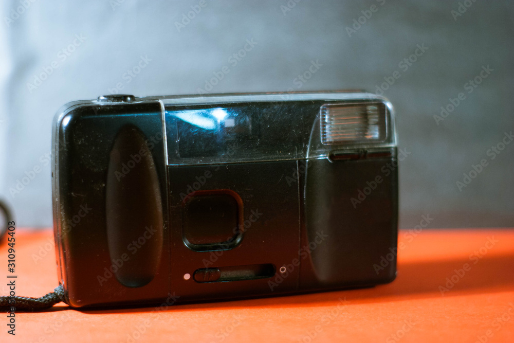 The camera on a red-black background The camera on a red-black background