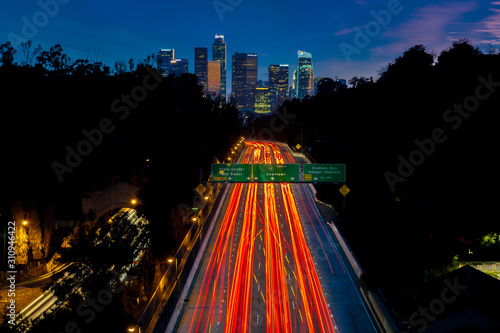 JANUARY 20, 2019, LOS ANGELES, CA, USA - Pasadena Freeway  (Arroyo Seco Parkway) CA 110 leads to downtown Los Angeles with streaked car lights at sunset photo