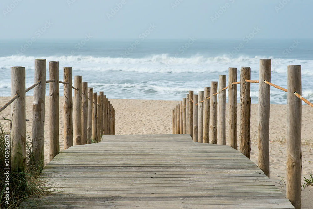 wooden walkway to access the beach of Esmoriz in Portugal