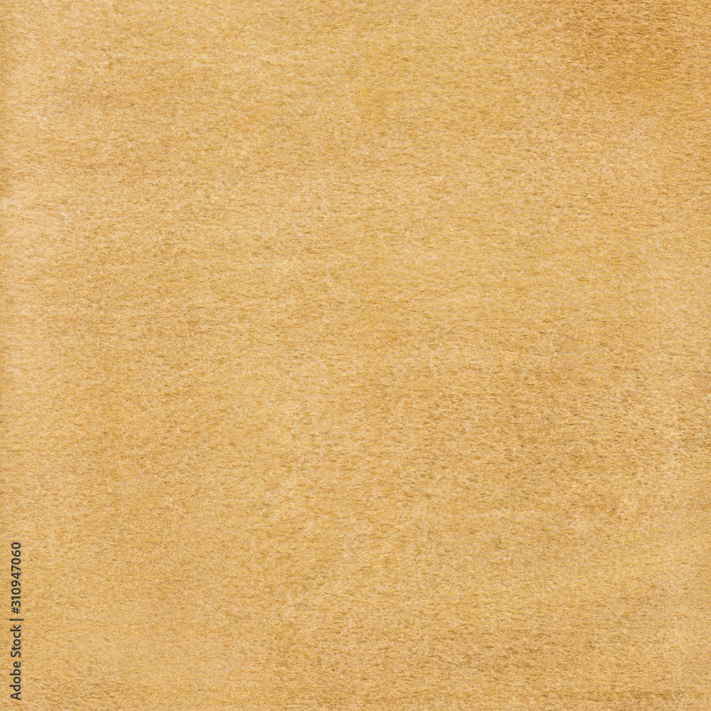 Gold watercolor background with textured surface on rough paper. Gold watercolor background with textured surface on rough paper.